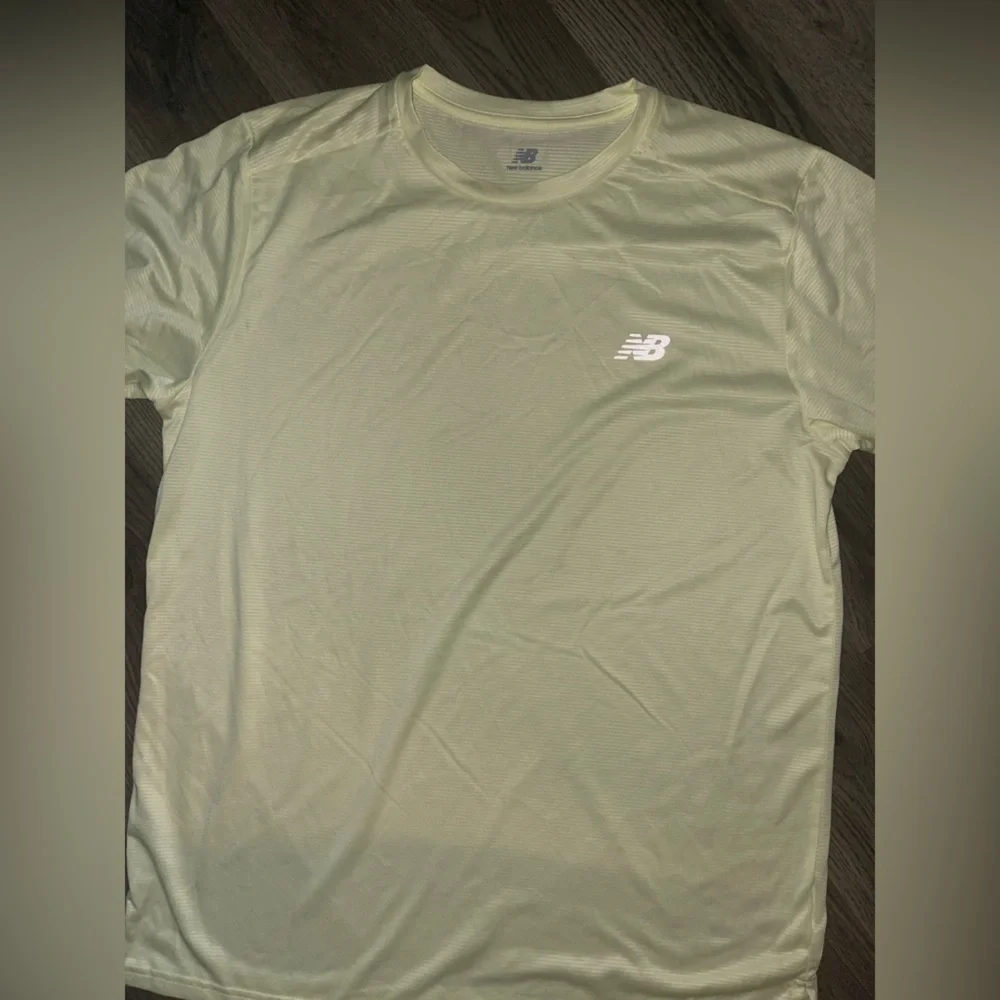 New Balance dri fit shirt (new without tags) light yellow